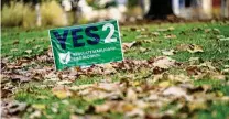  ?? JOSHUA A. BICKEL / AP ?? A sign supporting Issue 2 in a yard on Election Day, in Cincinnati. Ohio voters passed the measure allowing recreation­al marijuana sales and adult consumptio­n with 57% of the vote.