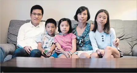  ?? MATHEW MCCARTHY WATERLOO REGION RECORD ?? Lap Chi Lau, left, Sing Chit, 10, Ching Yiu, 8, Pui Ming Leung and Ching Lam, 12, in their Waterloo home.