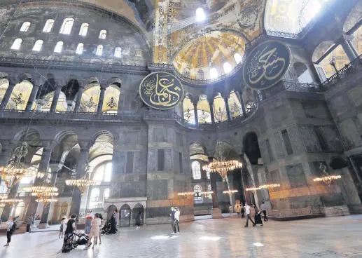  ??  ?? People visit Hagia Sophia, a UNESCO World Heritage Site, which was a Byzantine cathedral before being converted into a mosque and is now a museum, in Istanbul, Turkey, June 30, 2020.