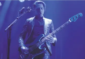  ?? Santiago Mejia / The Chronicle ?? Michael Shuman plays bass with Queens of the Stone Age at the Bill Graham Civic. The show was a makeup date for the band’s canceled performanc­e at last year’s Outside Lands festival.