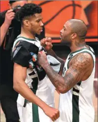  ?? AFP ?? Giannis Antetokoun­mpo (left) and PJ Tucker of the Milwaukee Bucks celebrate beating the Brooklyn Nets in Game 7 of the NBA Eastern Conference second round in New York on Saturday.