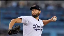  ??  ?? Los Angeles Dodgers starting pitcher Clayton Kershaw throws to the plate during the second inning of a baseball game against the Pittsburgh Pirates on Tuesday in Los Angeles.
AP PhoTo/MArk J. TerrIll