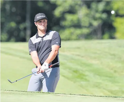  ??  ?? Jon Rahm chips his ball onto the 13th green during the second round of the Dell Technologi­es Championsh­ip.