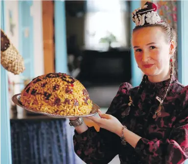  ??  ?? Lisan Yarullina displays a traditiona­l chak-chak during the 2018 soccer World Cup at the Chak-Chak Museum in Kazan, Russia. Tatar dessert that is traditiona­lly eaten at weddings has become a symbol of the autonomous region known as the “Land of 1,001...