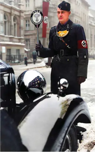  ?? ?? NSKK member on Traffic Education Duty, 1937. According to Adolf Huehnlein there should have been 6,000 members on patrol to admonish people for breaking the rules of the Highway Code *