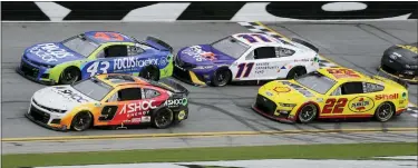  ?? TERRY RENNA — THE ASSOCIATED PRESS ?? Chase Elliott, front left, Erik Jones, rear left, Denny Hamlin, back left, and Joey Logano make their way through the front stretch during Sunday’s Cup Series race at Daytona Internatio­nal Speedway. All but Jones have qualified for the playoff.