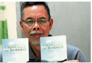  ?? — Bernama ?? Emin with his first book in English. Like his Malay language books, The Green Gold Of Borneo centres on Sabah’s natural resources.