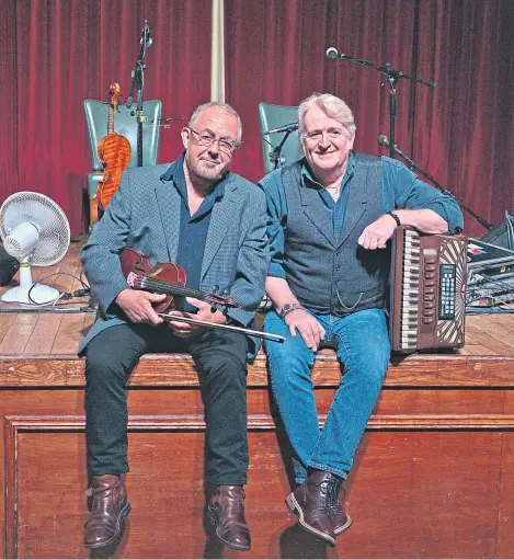  ??  ?? Aly Bain, left, and Phil Cunningham are back on the road in their 32nd year together.