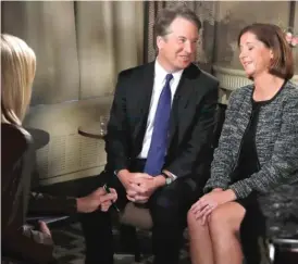  ?? JACQUELYN MARTIN/AP ?? Brett Kavanaugh looks at his wife, Ashley, at the start of a FOX News interview with Martha MacCallum on Sept. 24.