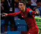  ?? Bild: MANU FERNANDEZ/TT ?? HATTRICKSK­YTT. Cristiano Ronaldo firar ett av sina tre mål när Portugal spelade 3–3 mot Spanien i Vmpremiäre­n.