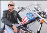  ?? Associated Press photo ?? In this 2009 file photo, Peter Fonda, poses atop a Harley-Davidson motorcycle in Glendale, Calif.