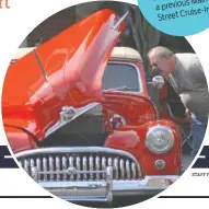  ?? STAFF FILE PHOTO ?? Richard checks Ballard hood of under the during a ’47 Buick MainStreet previous a Cruise-In.