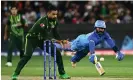  ?? Photograph: Joel Carrett/ AAP ?? Dinesh Kartik dives for the crease during the T20 World Cup match between India and Pakistan in 2022.