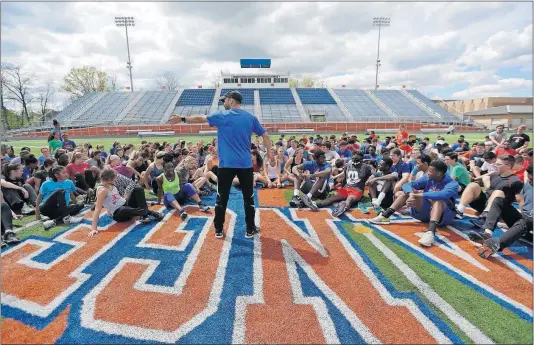  ?? [JONATHAN QUILTER/DISPATCH] ?? Olentangy Orange track coach Adam Walters talks to his team — which isn’t hurting for participan­ts with 141 boys and 121 girls — before a practice this week. When: Where: TV: Browns picks: Bengals pick: