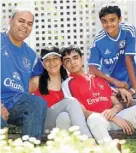  ??  ?? FOOTBALL FAMILY: Khan, Seedat and their teenage sons Nassar and Ameer each avidly support a different English Premier League soccer team