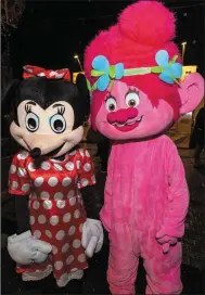  ?? Photo: John Delea ?? Minnie Mouse &amp; the Troll meet &amp; greet visitors in Macroom at the turning on of the Christmas Lights in Macroom.