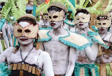  ??  ?? BAMBOO ATTIRE — This file photo taken at last year’s Abrenian Kawayan Festival shows parade participan­ts dressed in costumes made of bamboo. (Zaldy C. Comanda)