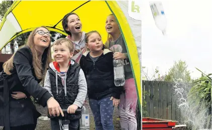  ?? PHOTO: STEPHEN JAQUIERY ?? Flying objects . . . English space engineer Sian Cleaver helps launch water rockets with children at a Dunedin kindergart­en open day yesterday, during the New Zealand Internatio­nal Science Festival. With her (from left) are Henry Richan (4), Bailey Goodman (10), Breneka Sinclair (7) and Kyrah Sinclair (11).