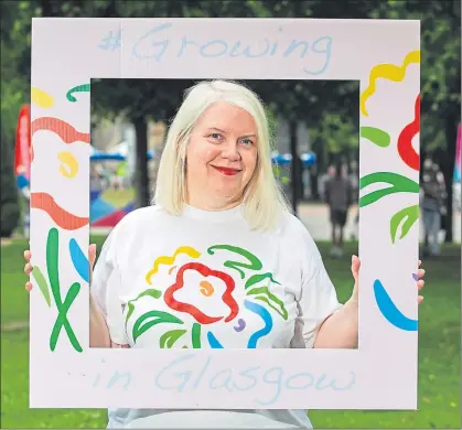  ??  ?? Shona Maciver wearing a t-shirt bearing the famous logo for the garden festival, left