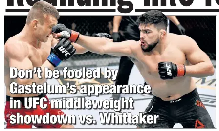  ?? Getty Images ?? STRIKING DISTANCE: Even though Robert Whittaker is the prohibitiv­e favorite, Kelvin Gastelum (right) — fighting Ian Heinisch at UFC 258 in February — has a skill set similar to Whittaker and perhaps a slight edge in quickness.