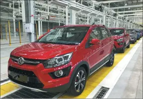  ?? PHOTOS PROVIDED TO CHINA DAILY ?? The first cars roll off the assembly line at BAIC Group’s production base in Port Elizabeth, South Africa,on July 24.