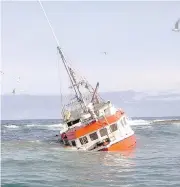  ?? COURTESY THE CANADIAN COAST GUARD ?? Top: Roger Lynn Stoddard, captain of the Fisherman’s Provider II. Above: The boat rammed up on Frying Pan Shoal, a lurking hunk of rock in the Atlantic Ocean.