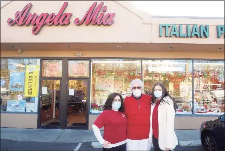  ?? Ned Gerard / Hearst Connecticu­t Media ?? Joe Agoglia poses with his daughter, Angela, left, and granddaugh­ter Cristina in front of Angela Mia Italian Bakery in Norwalk on Thursday. Agoglia opened the bakery 50 years ago in December 1970.