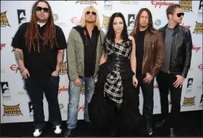  ?? (TNS/Getty Images/Frazer Harrison) ?? Evanescenc­e arrives at the 2012 Revolver Golden Gods Award Show at Club Nokia in Los Angeles. The band has released “The Bitter Truth,” its first album of new material since 2011.