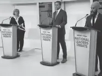  ?? FRANK GUNN/POOL VIA REUTERS ?? Elizabeth May, left, Andrew Scheer and Jagmeet Singh at last week’s debate.