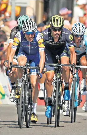  ??  ?? No surrender: Dan Martin (left) slipped back yesterday but will fight to the end Standings