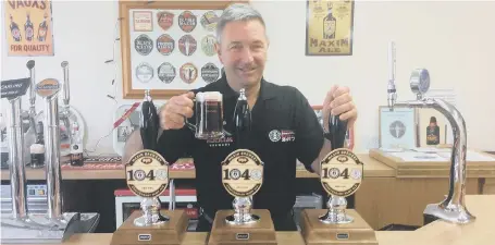  ??  ?? Maxim managing director Mark Anderson toasts the two anniversar­ies with a glass of the new beer.