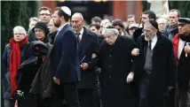  ?? (Reuters) ?? MOURNERS ATTEND the funeral of security guard Dan Uzan, a Jewish victim of an attack on a synagogue in Copenhagen, in February 2015.