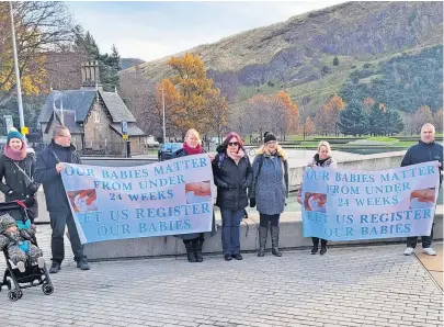  ?? ?? Making their message clear Julie, Bryan (both right) and other representa­tives of the charity at the Scottish Parliament