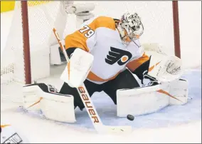  ?? FRANK GUNN - THE ASSOCIATED PRESS ?? Philadelph­ia Flyers goaltender Carter Hart (79) makes a save against the Boston Bruins during first-period NHL hockey playoff action in Toronto, Sunday, Aug. 2, 2020.