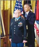  ??  ?? In this Sept 15, 2014 file photo, President Barack Obama bestows the Medal of Honor on retired Army Command Sgt Maj Bennie G. Adkins in the East Room of the
White House in Washington. (AP)