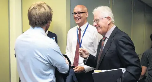  ?? PHOTO: GETTY IMAGES ?? Just joking . . . Tax Working Group chairman Sir Michael Cullen (right) shares a lighter moment with colleagues during the group’s announceme­nt at the Treasury in Wellington yesterday.