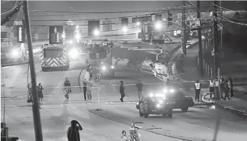  ??  ?? People make their way away from the bridge fire on Piedmont Road as emergency personnel work the scene of a bridge collapse at I-85 in Atlanta, Georgia, US. — Reuters photo