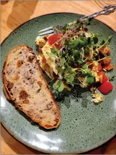  ?? BY CINDY BROWN/For the Taos News ?? Eggs, egg whites, veggies with some local sprouts and homemade walnut and fig sourdough can be a healthy early morning meal.