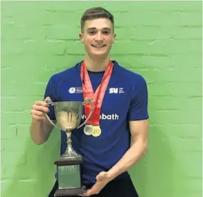  ??  ?? Bradley Sutton with his individual silver medal and the team trophy from the BUCS Pentathlon Championsh­ips