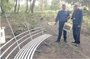  ??  ?? ●●Lewis Spence, from Highfields Inclusion Partnershi­p and Councillor Colin Foster, executive member for young people, with the bench