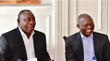  ?? ELMOND JIYANE GCIS ?? PRESIDENT Cyril Ramaphosa and his Deputy David Mabuza share a light moment with a team of advisers at the president’s official residence in Genadendal, as they apply final touches to the State of the Nation address. |