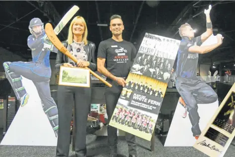  ?? PHOTOS: BEN WATERWORTH ?? Iconic items . . . Bill Richardson Transport World executive director Joc O’Donnell and events manager Adam Reinsfield show off some of the collection to be displayed at the New Zealand Cricket Museum, which will be temporaril­y housed in Invercargi­ll. Below: A bat signed by Martin Crowe and Sir Donald Bradman.