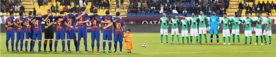  ??  ?? Contrast: Saudi team al-Ahli Saudi FC joins a minute’s silence against Barcelona last December … unlike their countrymen yesterday