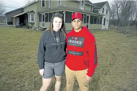  ?? JULIE JOCSAK/STANDARD STAFF ?? Ruby Benner and her boyfriend Jayden Hannigan are photograph­ed at Ruby’s father’s house in Gasline, in rural east Port Colborne, where vandals broke in and in black spraypaint left racist graffiti targeting the teen and her boyfriend.