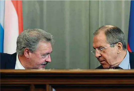  ?? Foto: AFP ?? Außenminis­ter Jean Asselborn (l.) und sein russischer Amtskolleg­e Sergej Lawrow im Februar 2014 bei einem Treffen in Moskau.