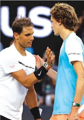 ??  ?? Rafael Nadal is congratula­ted by Alexander Zverev of Germany after yesterday’s match between them Photo: AP