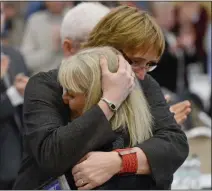  ??  ?? FINDING HER VOICE:
Karen Leach is embraced by Kate Hills, national children’s officer for
Swim Ireland, after delivering the keynote speech at a conference on the code of ethics and good practice for children’s sport