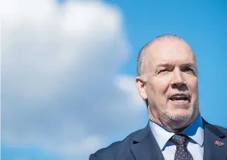  ?? DARRYL DYCK/THE CANADIAN PRESS ?? B.C. Premier John Horgan’s actions opposing the lawfully approved Trans Mountain project have triggered a trade war with Alberta, and exposed his province to potentiall­y hard retributio­n both from Alberta and from the federal government, Claudia...