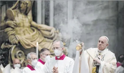  ?? Filippo Monteforte The Associated Press ?? Pope Francis prepares to celebrate the Eucharist during Easter Mass at St. Peter’s Basilica at The Vatican on Sunday.