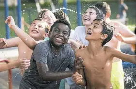  ?? Stephanie Strasburg/Post-Gazette ?? Jay Ross Szczypinsk­i, front left, 10, of Green Tree plays in the spray park at Mellon Park Monday during his friend Nadav’s 11th birthday party in Shadyside. The boys start school this week, and the party was their last celebratio­n of the summer.